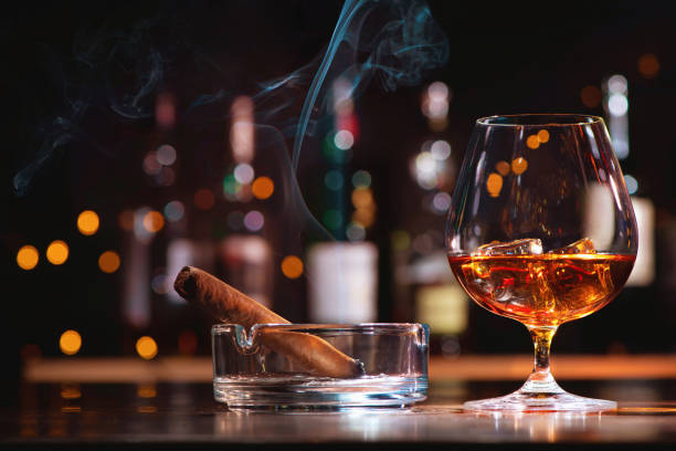 	What are the pros and cons of smoking cigars or a pipe?